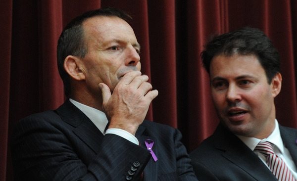 Tony Abbott and his Parliamentary Secretary, Josh Frydenberg, have pledged to repeal legislation that causes unnecessary red tape for businesses. AAP/Julian Smith